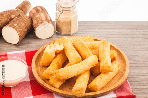 Fried cassava in wood background