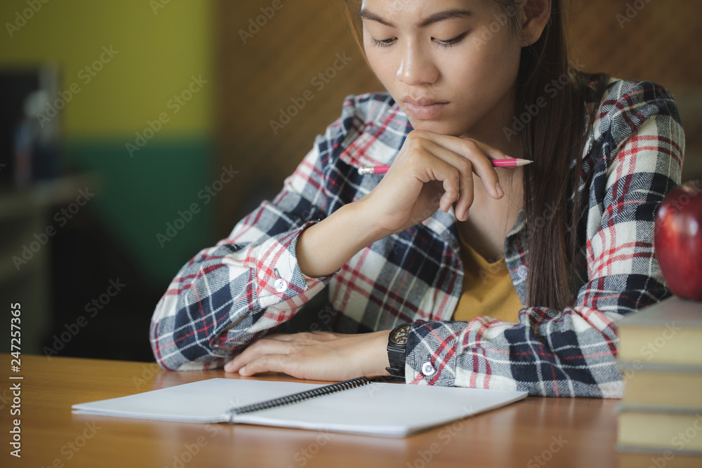 Students write books in the library, Education concept. Students write books in the library, Education concept.