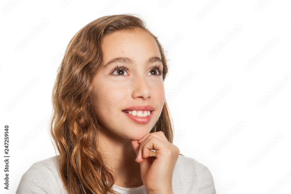 Beautiful young girl thinking or having an idea isolated on white background Beautiful young girl thinking or having an idea isolated on white background