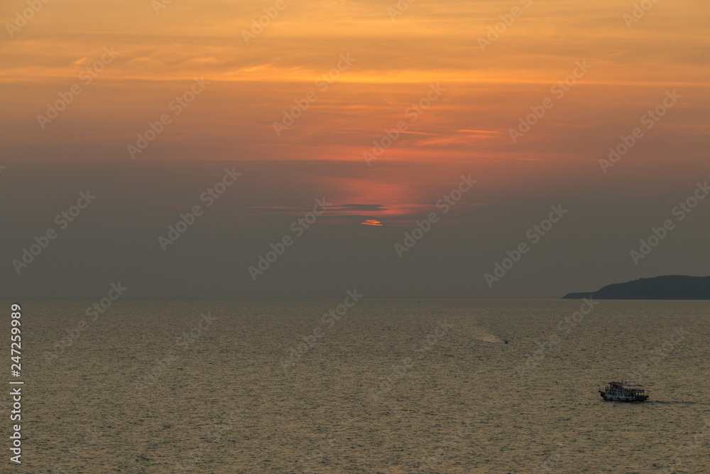The blurred background of the grass on the seafront and the back has a beautiful light blue sunset. The blurred background of the grass on the seafront and the back has a beautiful light blue sunset.