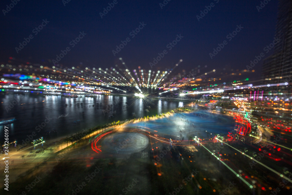 Abstract background Of the night lights, with lights from (cars, passenger boats, street lights), a beautiful art wallpaper