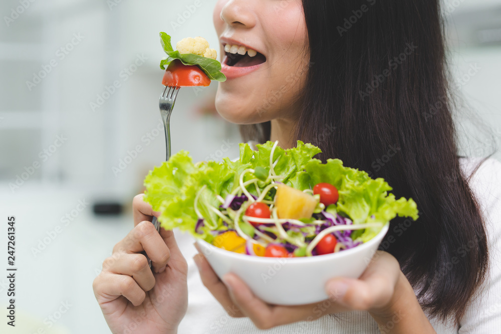 Eat green for wellness. Young girl enjoy eating vegan. Eat green for wellness. Young girl enjoy eating vegan.
