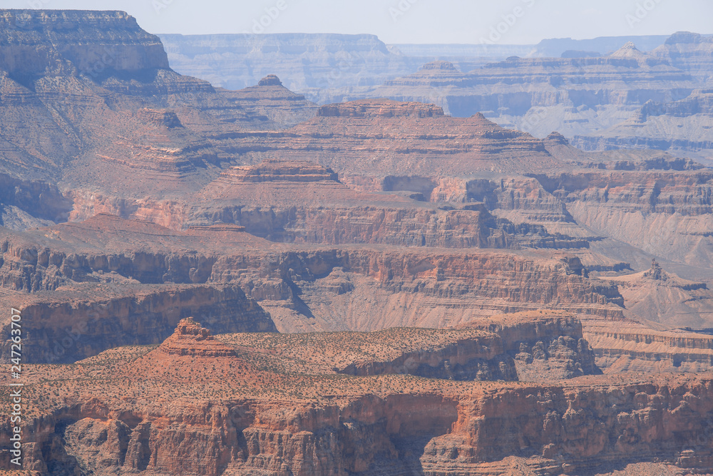 Closeup view on red rocks of Grand Canyon on sunny day Closeup view on red rocks of Grand Canyon on sunny day