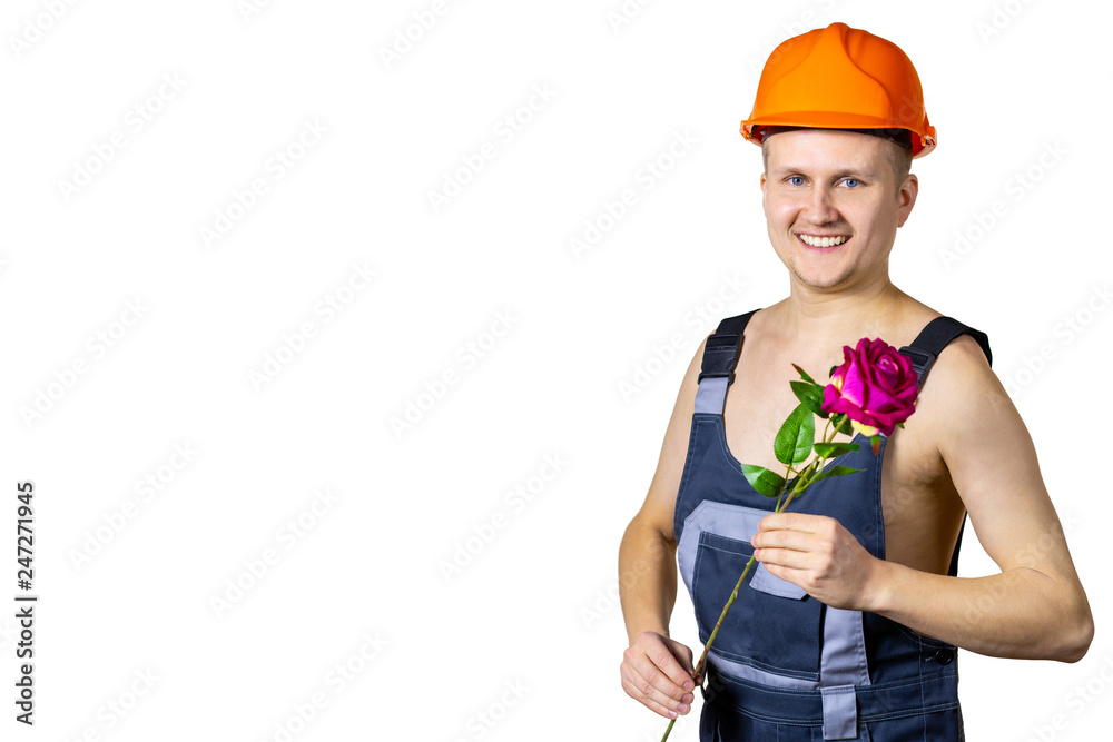Builder with a flower to congratulate a woman on March 8. International Women's Day. Builder with a flower to congratulate a woman on March 8. International Women's Day.