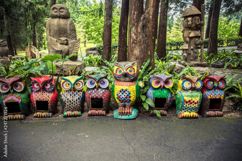 Colorful decoration owls sculpture locate in Formosan Aboriginal Culture Village in Nantou County, Taiwan.