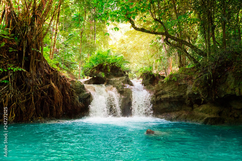 Kawasan waterfall in a mountain gorge in the tropical jungle of the Philippines  Cebu.