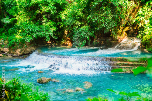 Kawasan waterfall in a mountain gorge in the tropical jungle of the Philippines  Cebu.