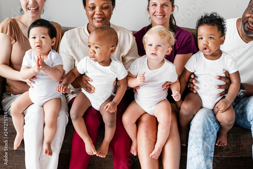 Diverse babies with their parents photo