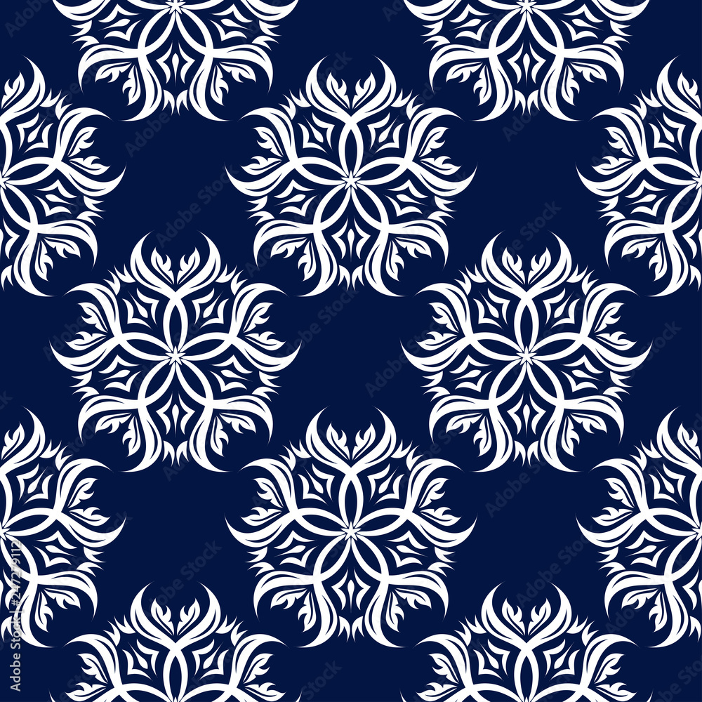 Floral seamless background. White pattern on dark blue backdrop Floral seamless background. White pattern on dark blue backdrop