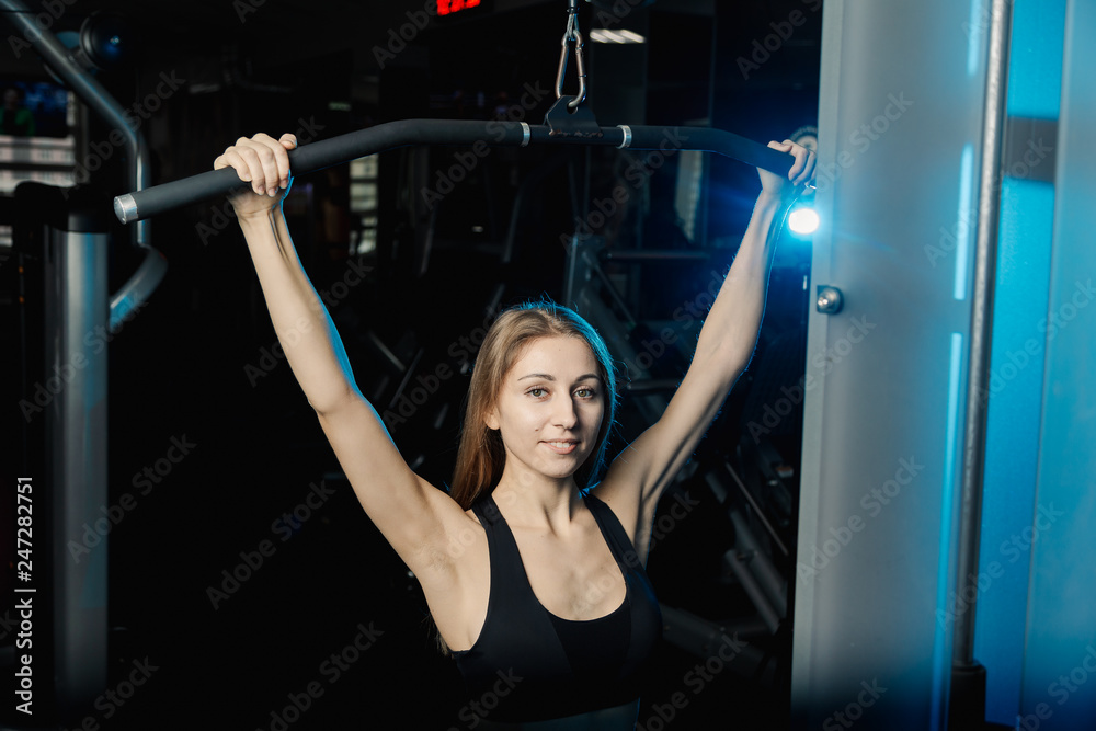 Thrust for the head, block simulator. Woman sit and warm-up. Studio shot. Thrust for the head, block simulator. Woman sit and warm-up. Studio shot.