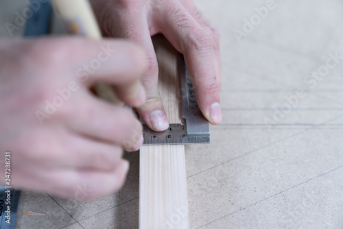 Technician handles a variety of woodworking tools to make wooden products. Both hand and machine tools are used after carpenters measure exact size by different types of rulers.