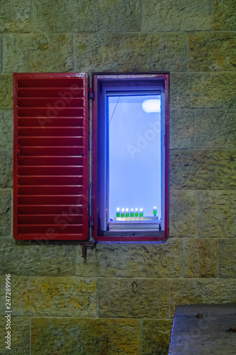 Traditional Menorah (Hanukkah Lamp) with olive oil candles, Jerusalem photo