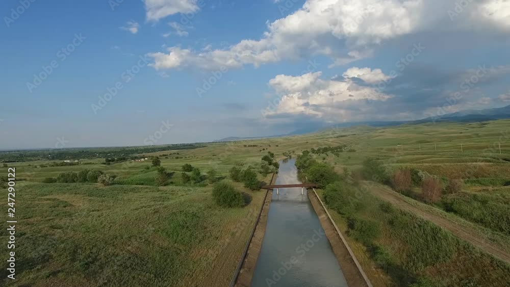 Large irrigation canal. Kazakhstan. View from the air. In summer. Beautiful landscape. Large irrigation canal. Kazakhstan. View from the air. In summer. Beautiful landscape.