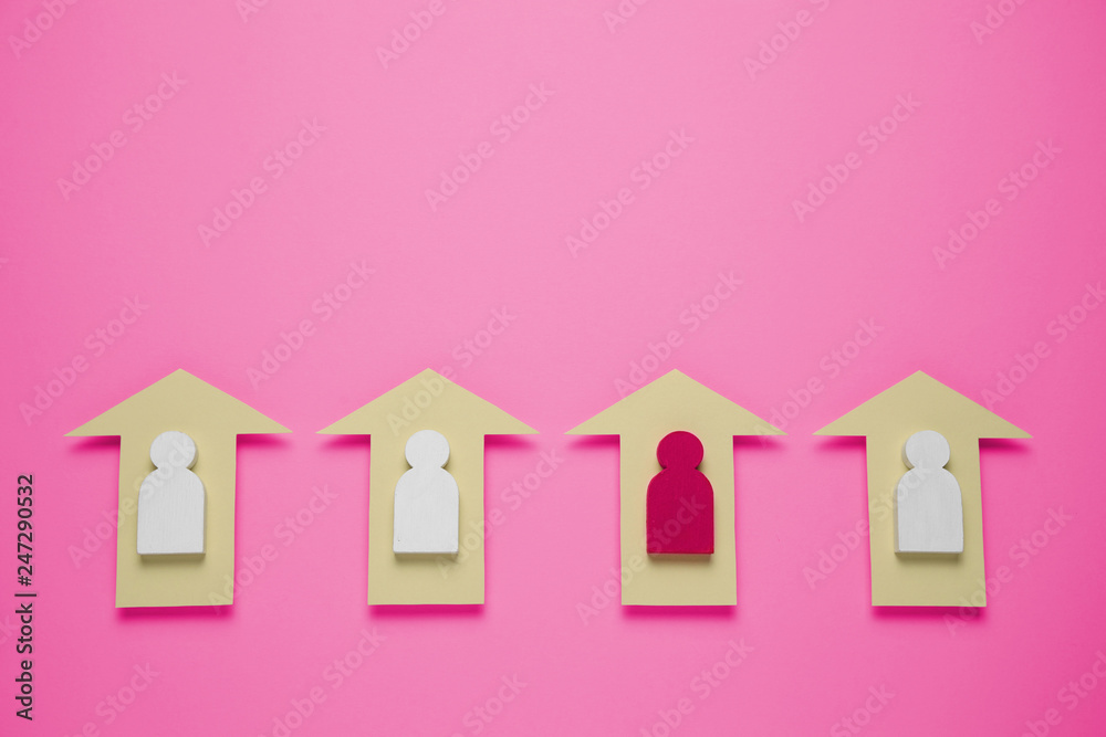 Figures of people and arrows on plastic pink background. Women's achievements in life and business. Figures of people and arrows on plastic pink background. Women's achievements in life and business.