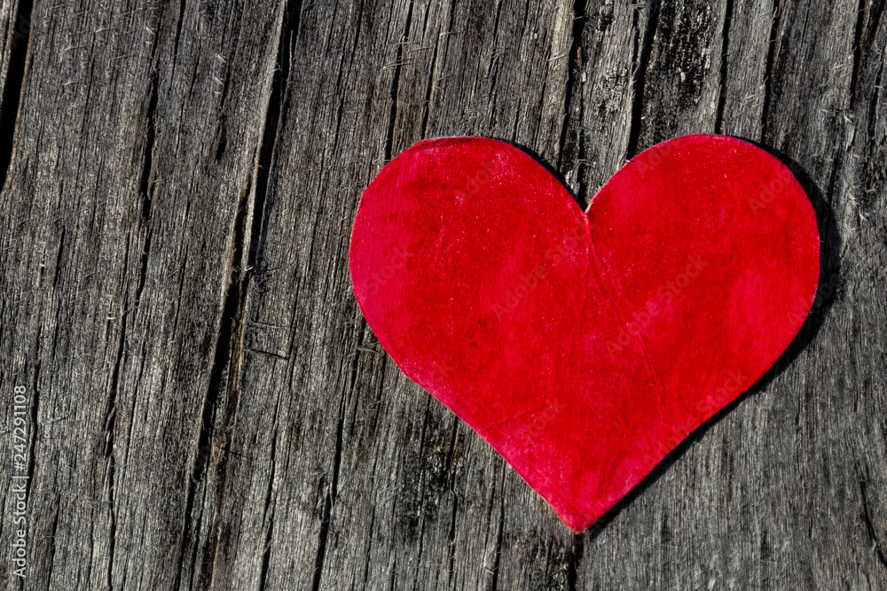 Valentines day red heart on old wood with copy space Valentines day red heart on old wood with copy space