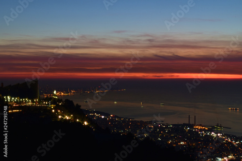 dramatic dusk over mediterranean sea and Beirut shot from Harissa, Mount Lebanon photo