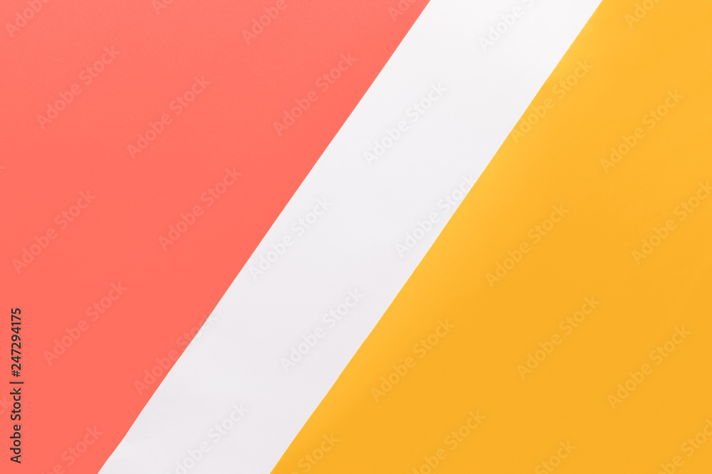Abstract geometrical living coral, yellow and white paper flat lay background. Minimal, geometry and symmetry paper texture template.