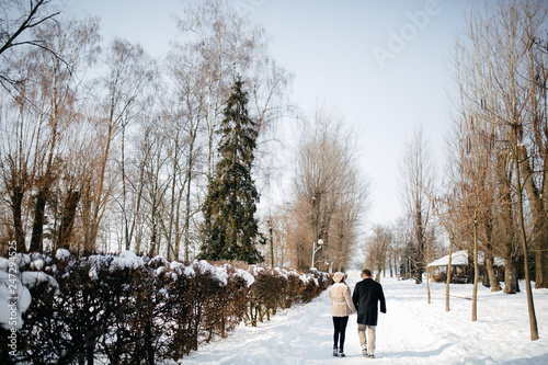 Young Beautiful Couple Taking Fun and Smiling Outdoors in Snowy Winter