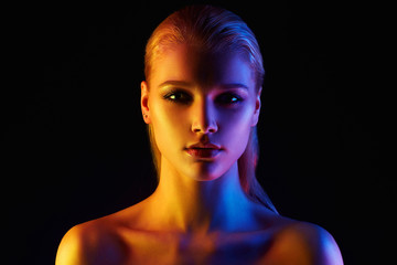 Rainbow woman. Beautiful Girl in color lights
