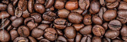 Coffee beans background texture panoramic banner.