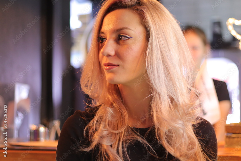 Portrait of a beautiful young woman in a nightclub.