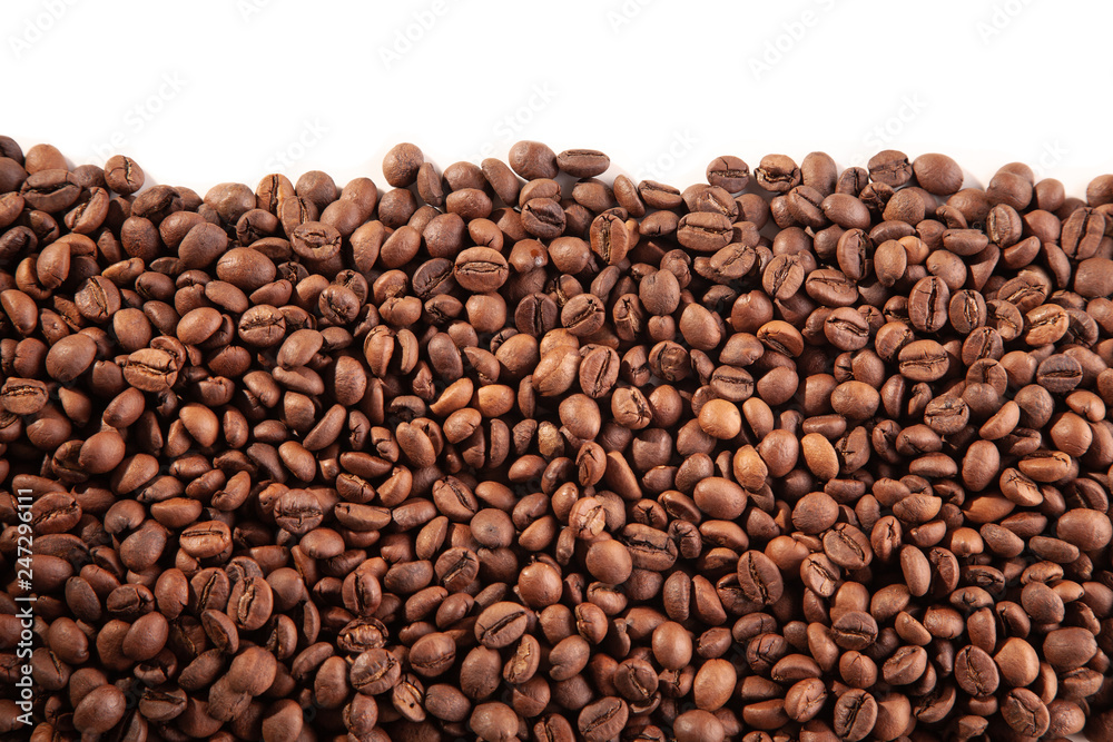  Textured brown coffee beans on a white background.
