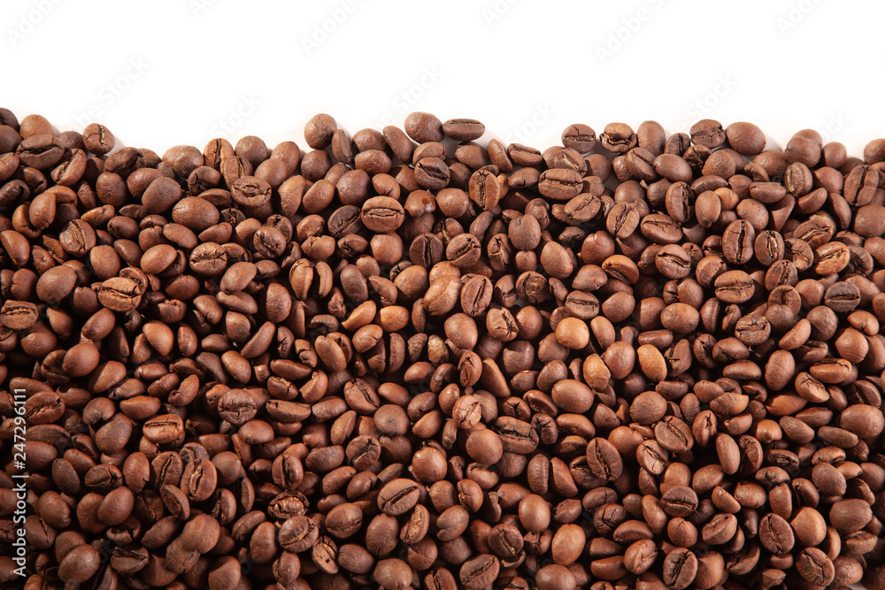 Textured brown coffee beans on a white background. Textured brown coffee beans on a white background.