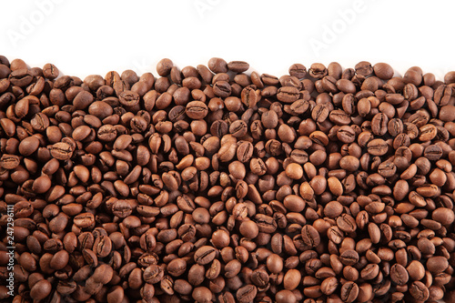  Textured brown coffee beans on a white background.