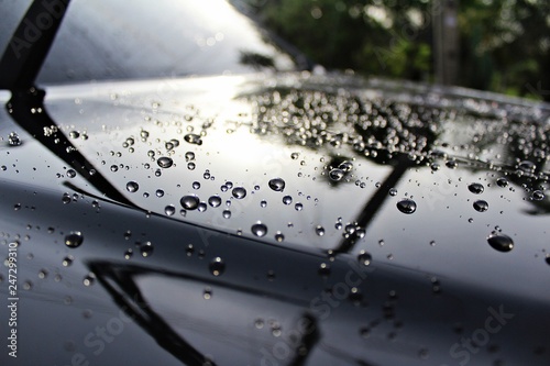 Water droplet on car hood after washed in carcare ,It's shiny and clean.