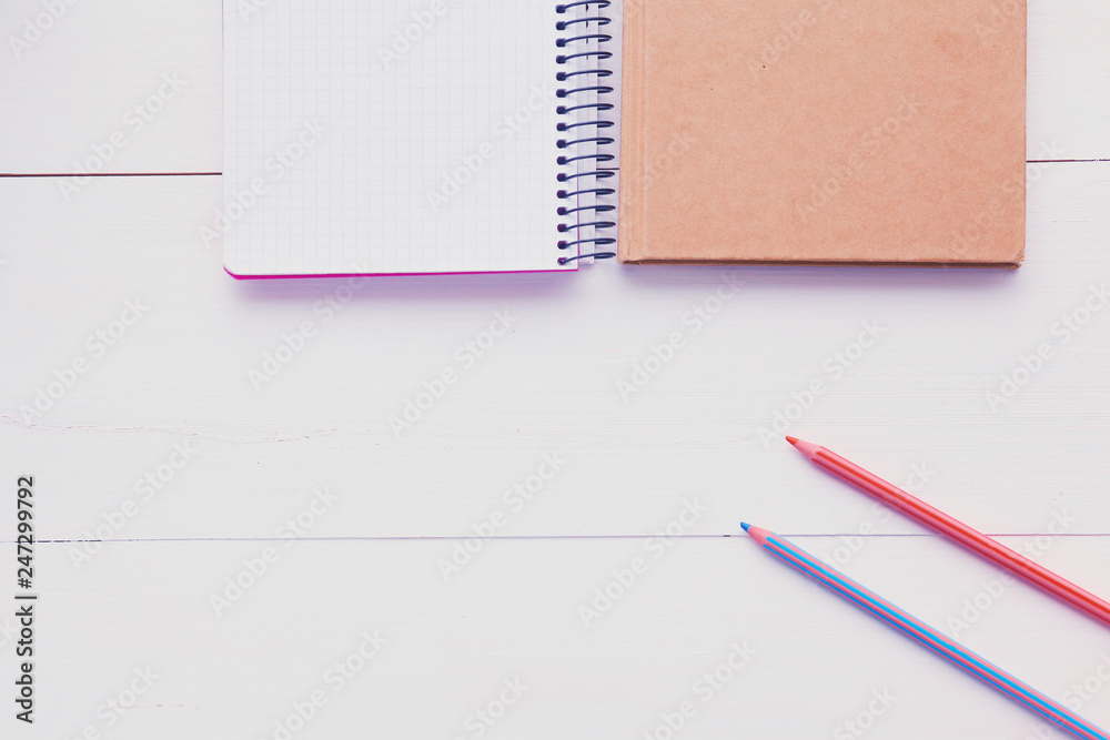 top view image of open notebook with blank pages on wooden table. ready for adding text or mockup. top view image of open notebook with blank pages on wooden table. ready for adding text or mockup.