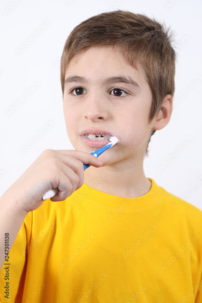 Portrait Of Cute Little Boy Washing His Teeth On White Background Close Up Portrait Of Cute Little Boy Washing His Teeth On White Background Close Up