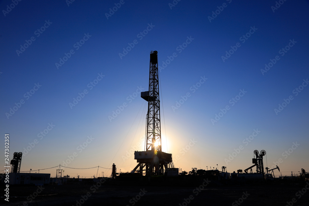 Oil drilling derrick in oilfield