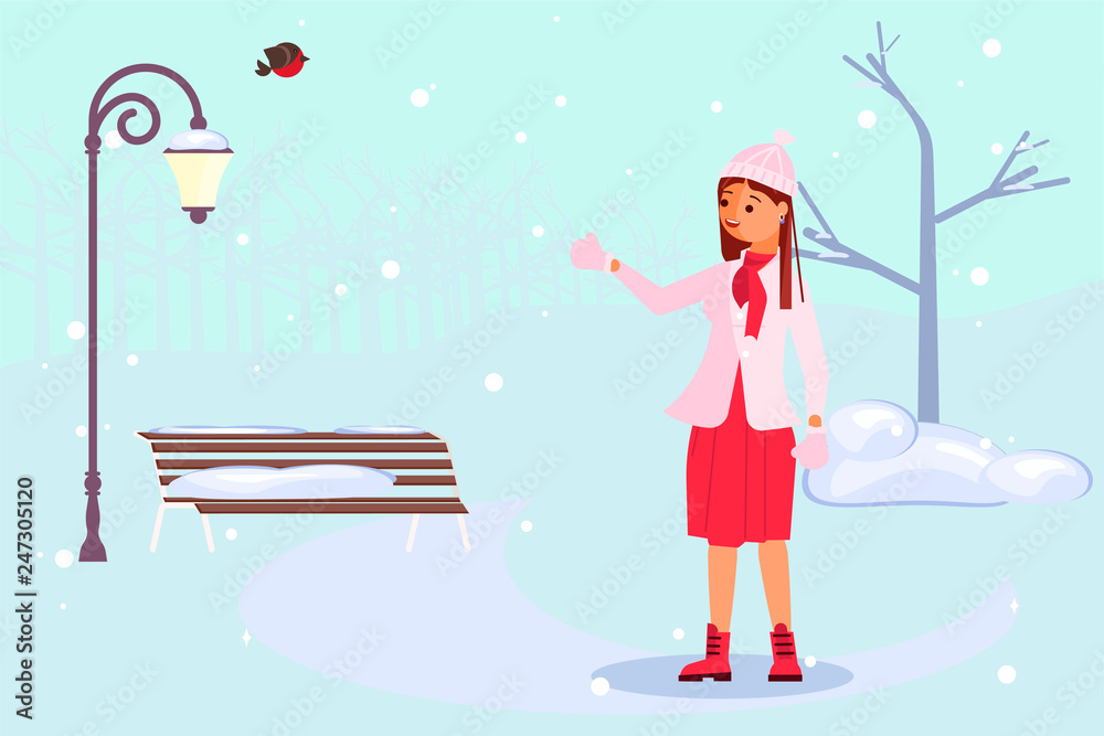 Woman walking through a snow covered park Woman walking through a snow covered park