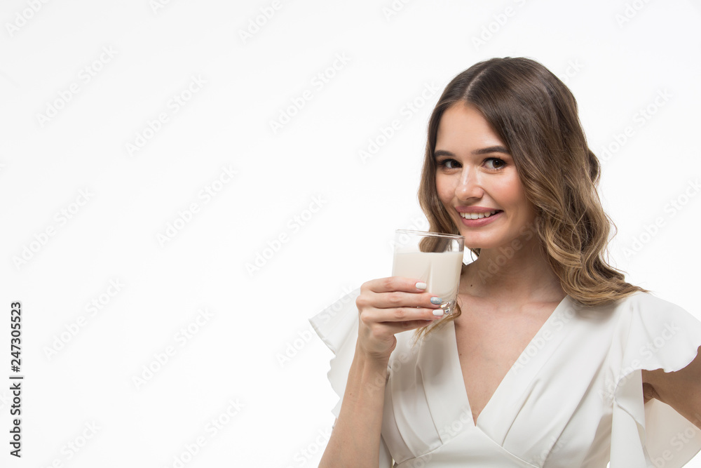 One beautiful healthy woman holding a glass of milk. white background One beautiful healthy woman holding a glass of milk. white background