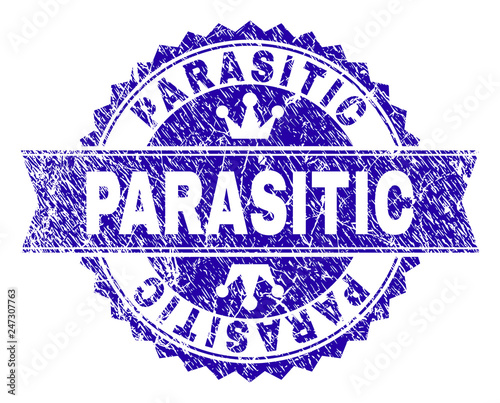 PARASITIC rosette seal watermark with distress style. Designed with round rosette, ribbon and small crowns. Blue vector rubber watermark of PARASITIC tag with retro style.