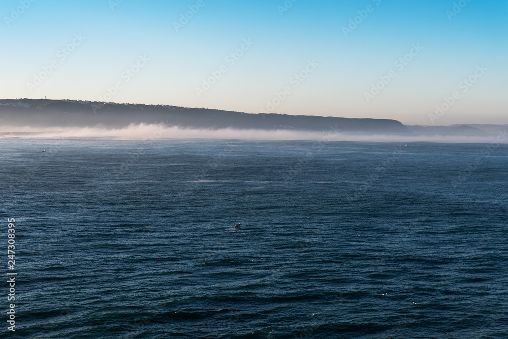 Obraz premium Atlantic ocean in morning at Nazare, Portugal.