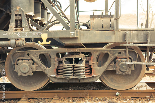 Details from train rail wagon. Springs and wheels.