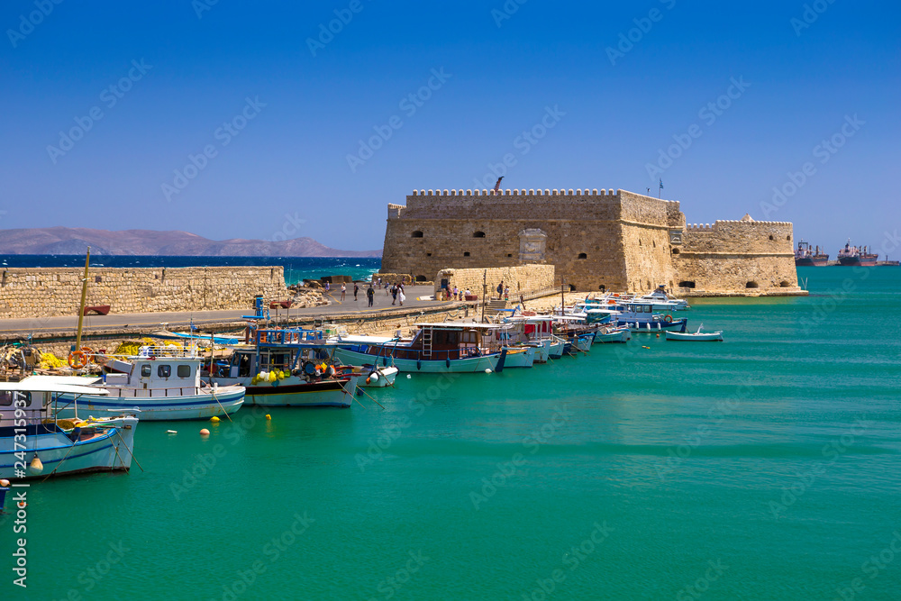 Fishing boats and Venetian Fortress in Heraklion, Crete, Greece
