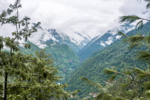 Tropical mountain range view. Timelapse Of Moving Clouds And Fog over Himalayan mountain range in Sainj