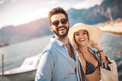 Couple in love, enjoying the summer time by the sea.