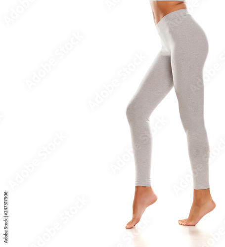 Sporty gray leggings on slim pretty legs