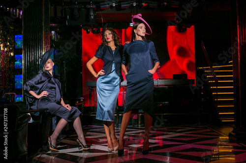 Three beautiful models in a stylish designer clothes