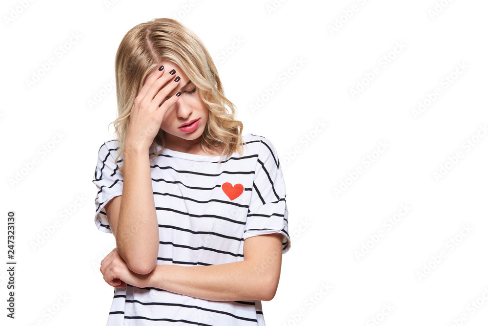 Stressed Exhausted Young Female Student Having Headache. Feeling Pressure And Stress. Depressed Student With Head in Hands Over White Background. Stressed Exhausted Young Female Student Having Headache. Feeling Pressure And Stress. Depressed Student With Head in Hands Over White Background.