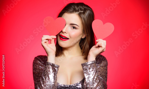 Girl pretty wearing orthodontic braces and smiling. How to kiss with braces. Woman makeup red lips hold heart symbol love. Valentines day concept. Braces and beauty. Dating when you have adult braces
