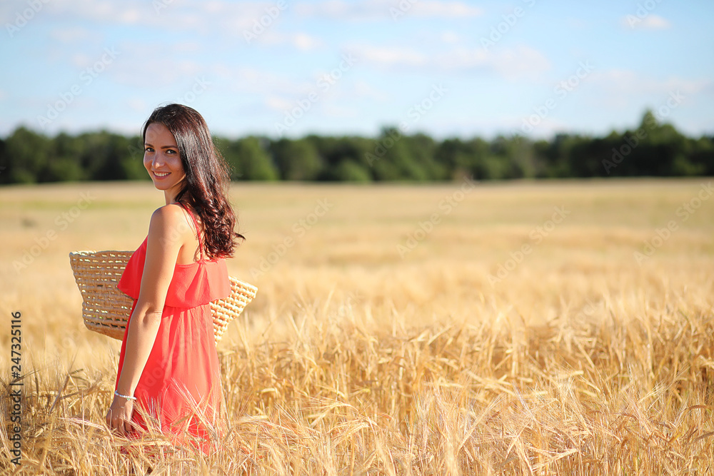 Obraz premium Summer landscape and a girl on nature walk in the countryside.
