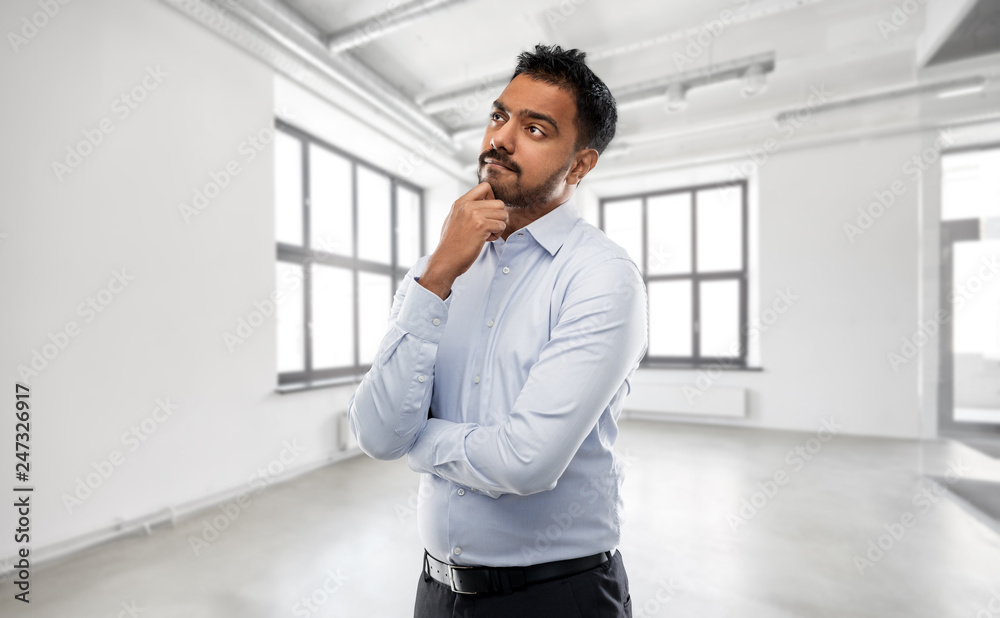 business, realty and people concept - indian businessman or realtor over empty office room background business, realty and people concept - indian businessman or realtor over empty office room background