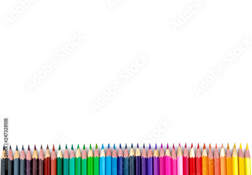 Many color pencils on white isolated background. close-up. view from above. stationery. space for text