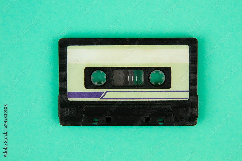 Fototapeta premium Retro cassette tape a on bright green background