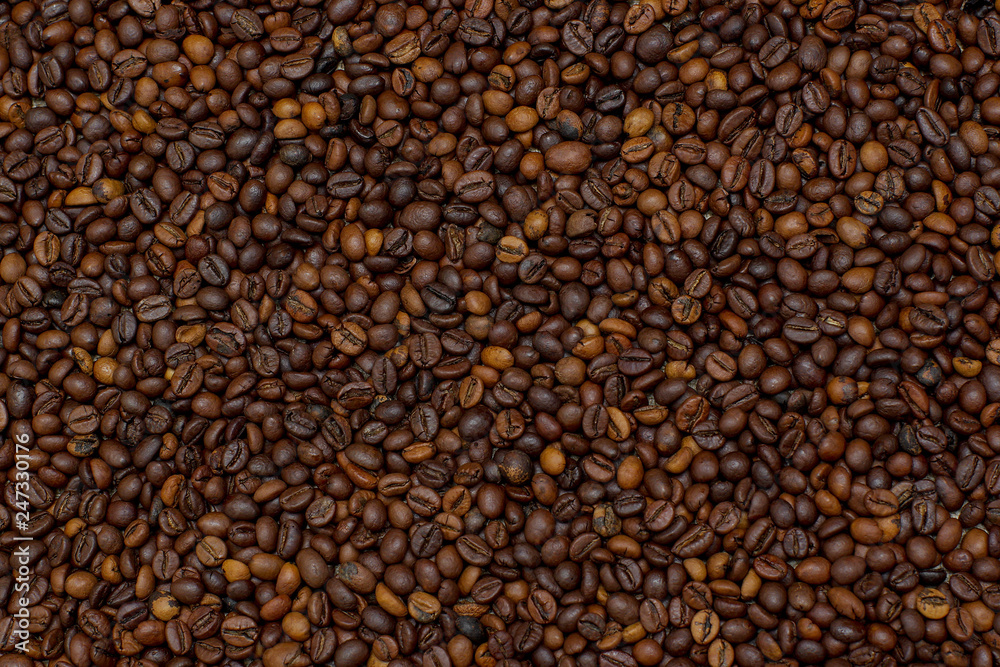 Obraz premium Coffee beans texture. Coffee background. Сoffee grain. Background image of many coffee beans filling the picture
