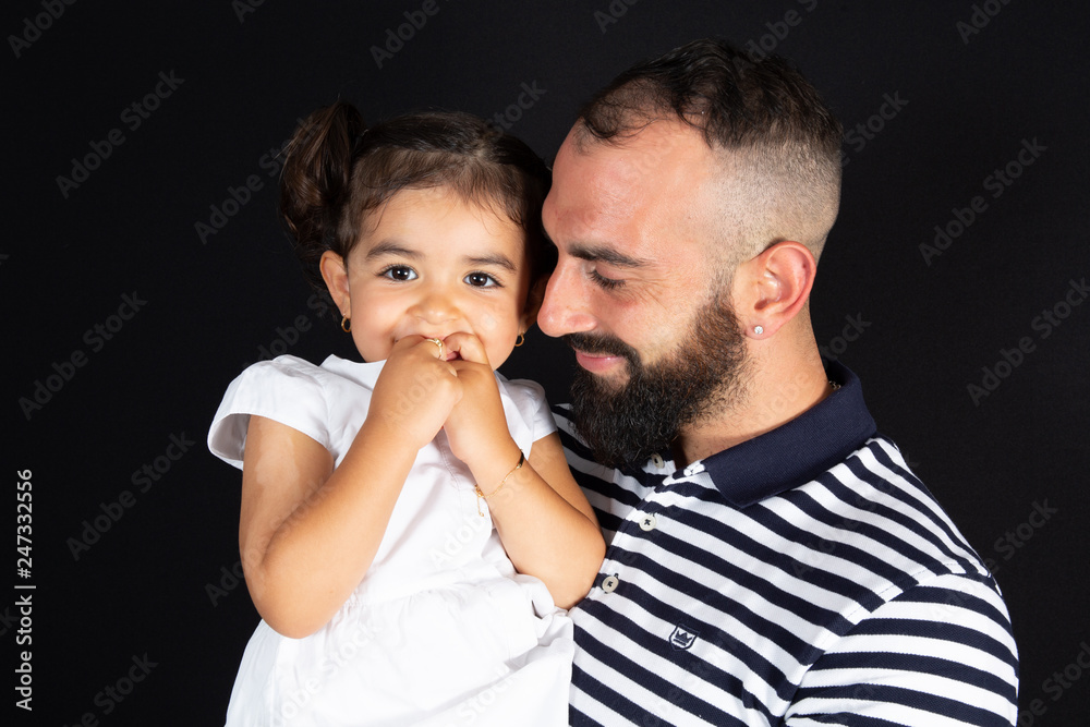 happy smiling daughter in father arms on black background happy smiling daughter in father arms on black background